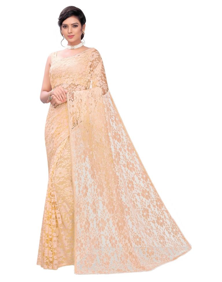 Light Orange Coloured Embellished Russel Net Saree | Leemboodi