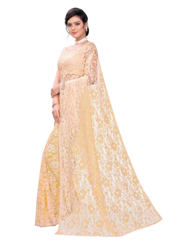 Light Orange Coloured Embellished Russel Net Saree | Leemboodi