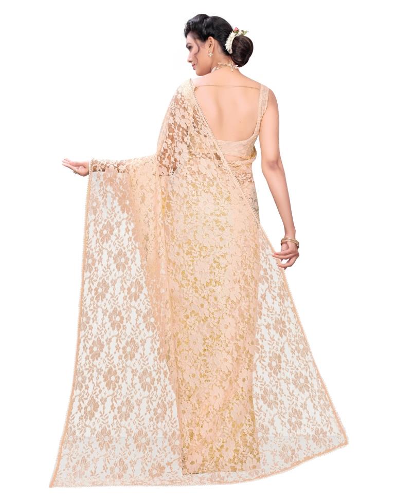 Light Orange Coloured Embellished Russel Net Saree | Leemboodi