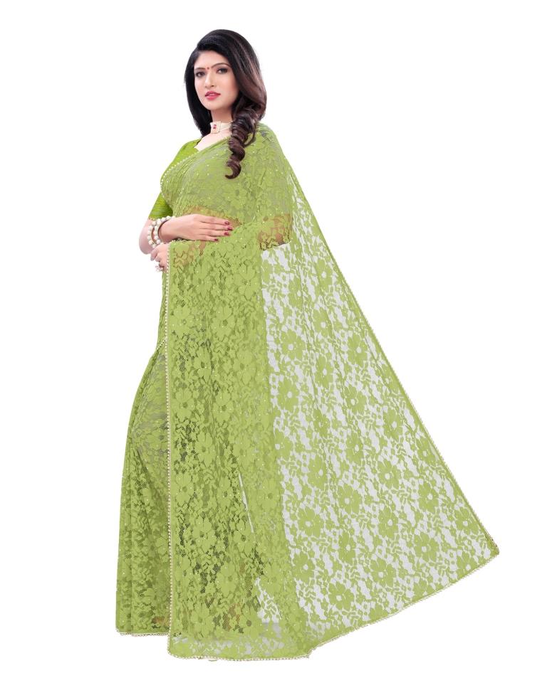Parrot Green Coloured Embellished Russel Net Saree | Leemboodi