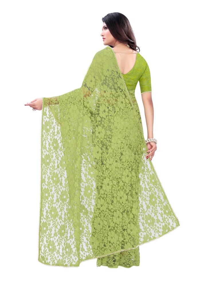 Parrot Green Coloured Embellished Russel Net Saree | Leemboodi