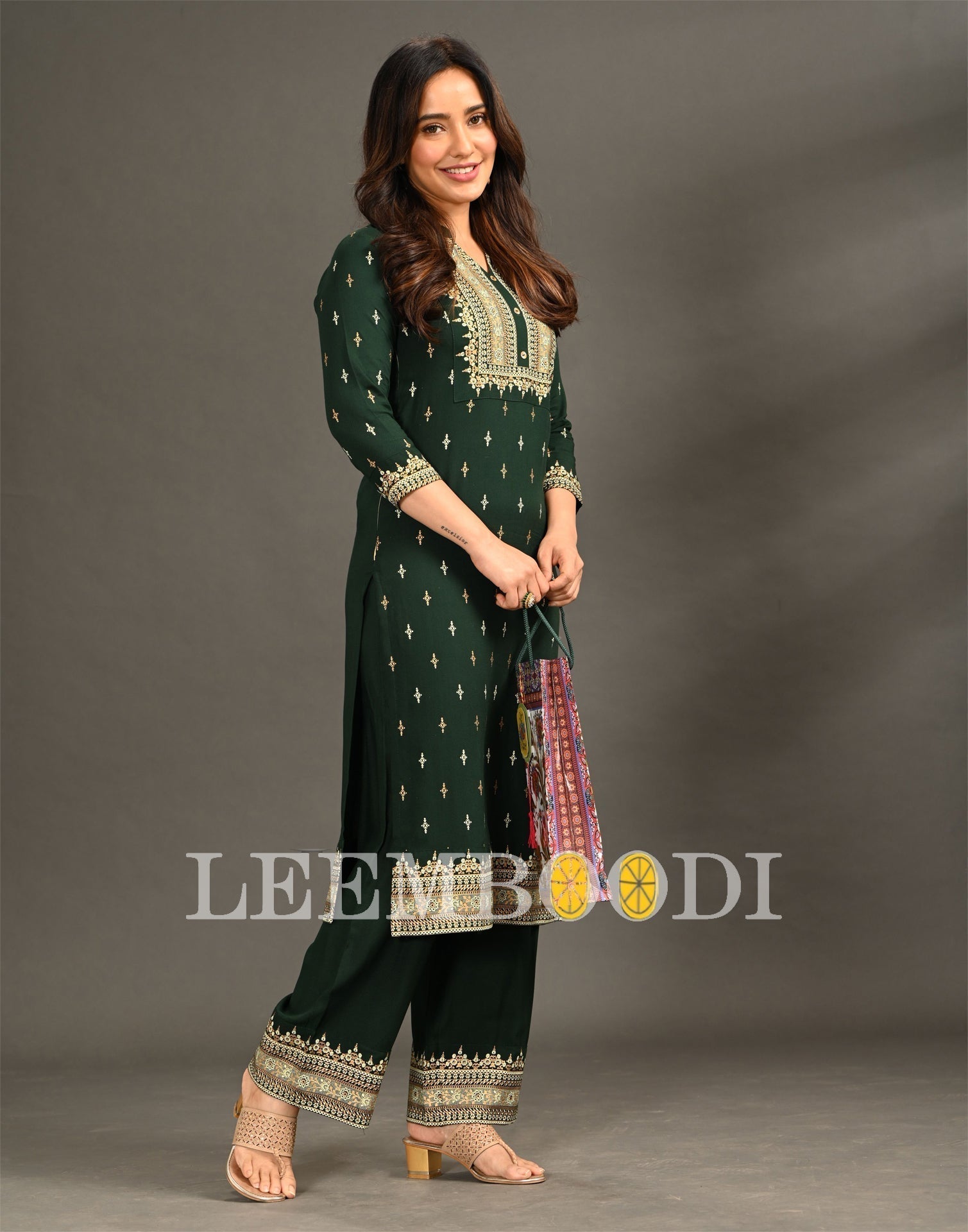 Bottle Green Coloured Rayon Foil Printed Kurti With Palazzo | Leemboodi